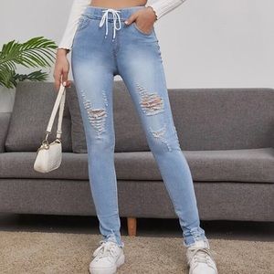 Women’s drawstring waist raw hem ripped jeans